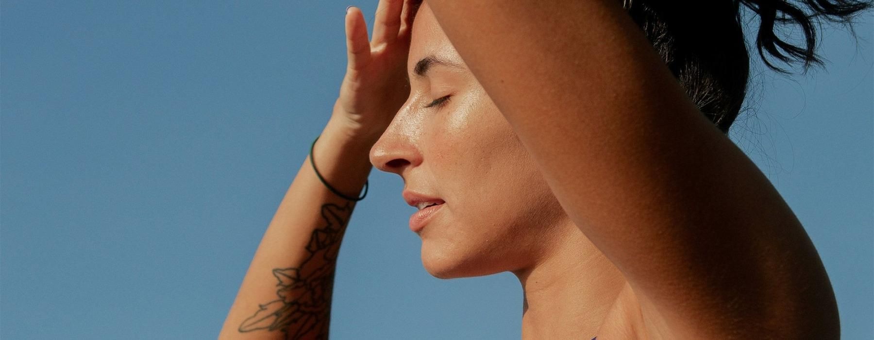 a woman putting up her hair